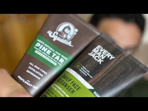 Close-up comparison of Every Man Jack Daily Face Cleanser and Dr. Squatch Pine Tar face wash tubes held in hand